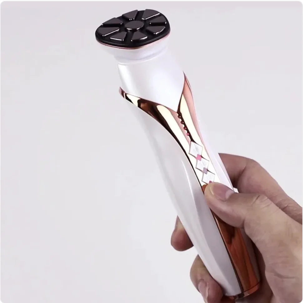 Hand holding a white and rose gold electronic device on a light gray background